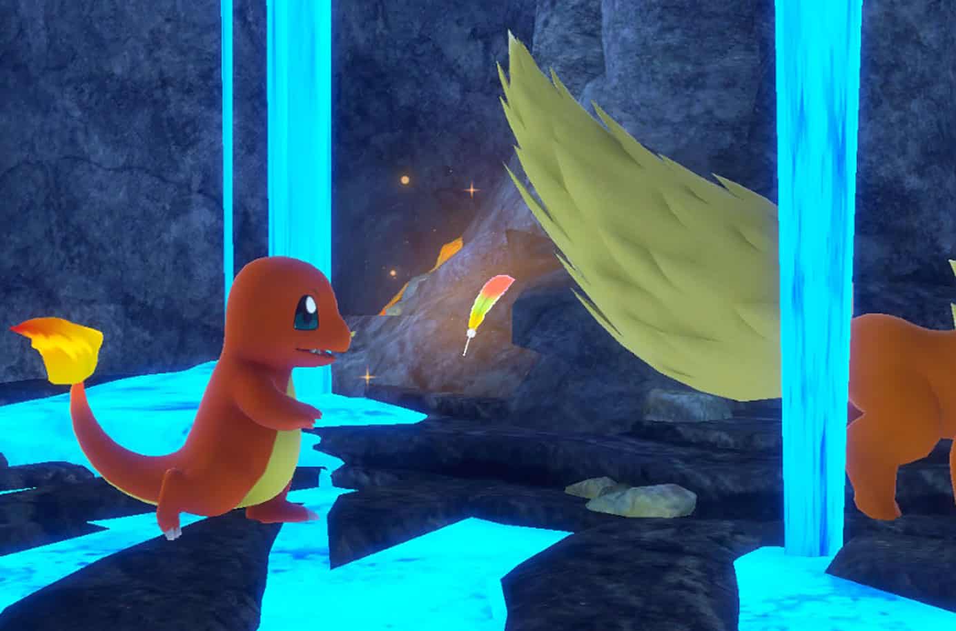 Charmander und Flareon neben Ho-Oh-Feder in New Pokemon Snap