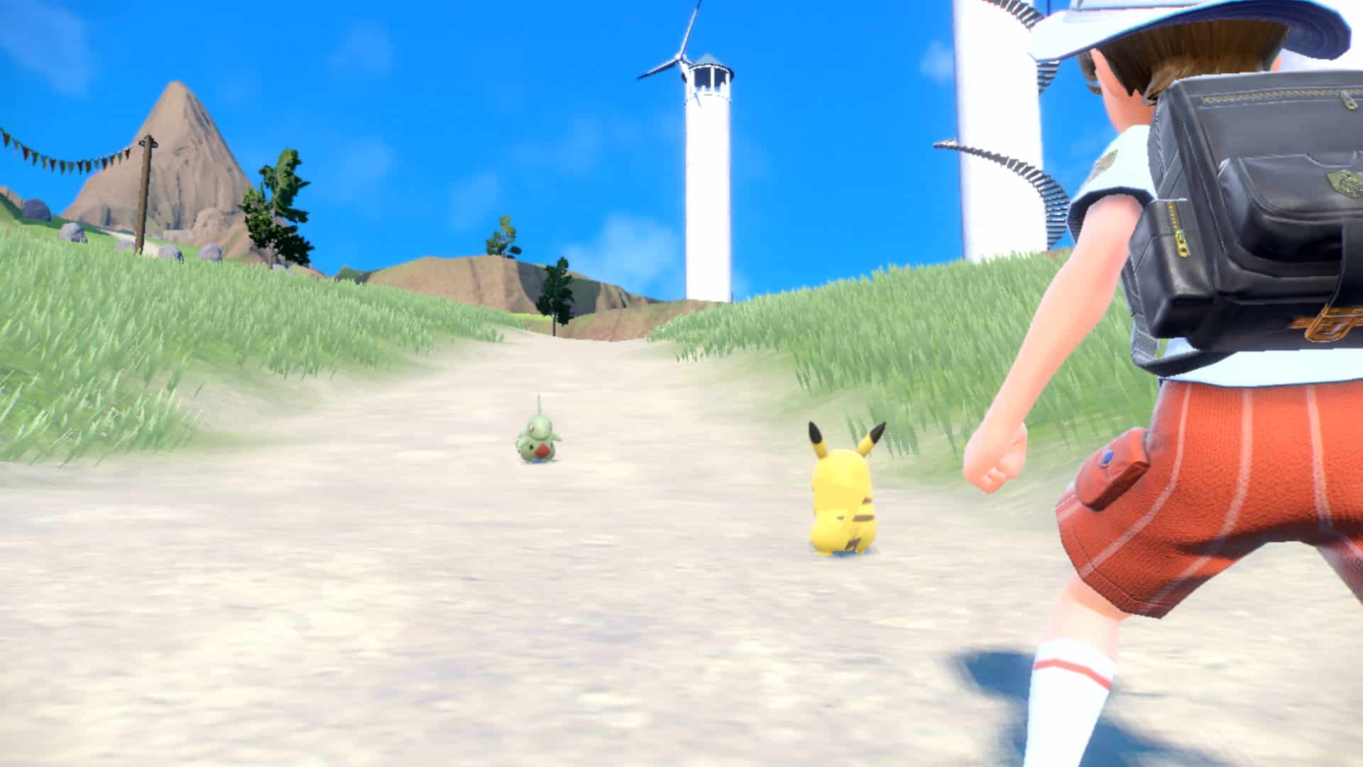 Screenshot des Kampfes Pokémon Scarlet & Violet Pikachu vs. Larvitar.