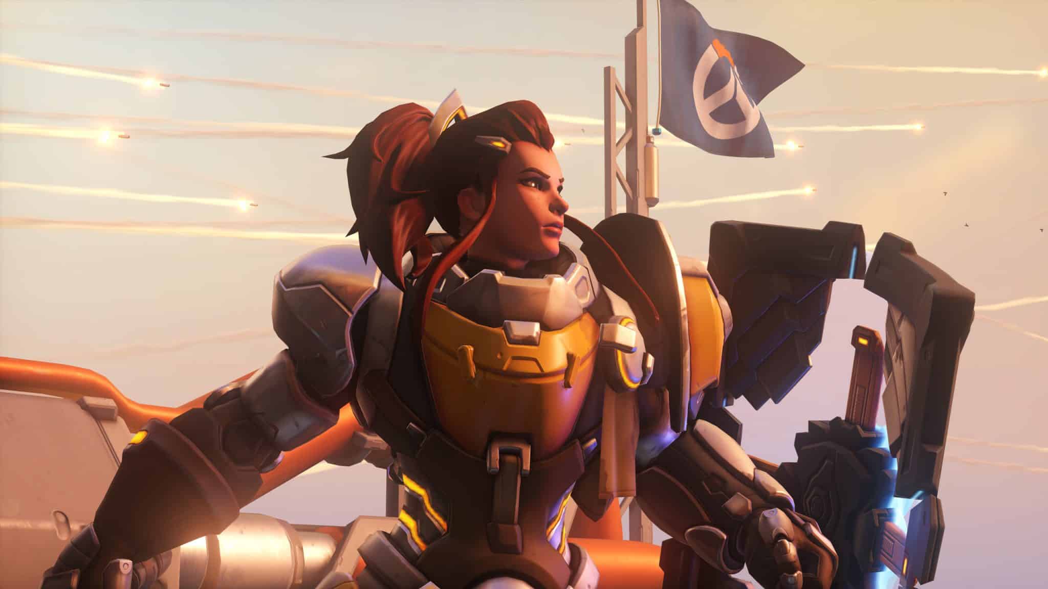 overwatch brigitte blickt mit einer flagge hinter sich in den sonnenuntergang von gibraltar